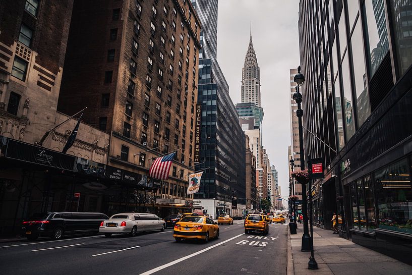 Yellow cabs overlooking Chrysler building in Manhattan, New York by Thea.Photo