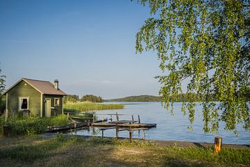 Idyllic picture of a small lake in southern Finland by Caroline Pleysier