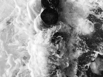 Groynes in the surf from above black and white by Jörg Hausmann
