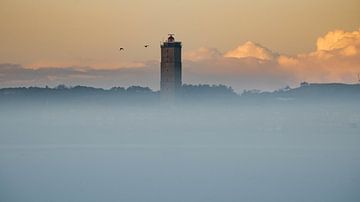 Brandaris rises nicely above the fog by Marjolein van Roosmalen