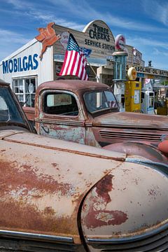 Three Creeks Service station with vintage trucks. by Albert Brunsting