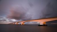De Zeelandbrug bij ondergaande zon van Jan Jongejan thumbnail
