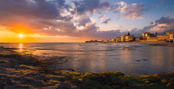 Vibrant Golden Sunset Over Punta Secca's Serene Sicilian Coast, 