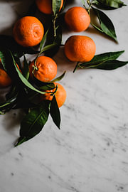 Mandarins and Green on Marble by MADK