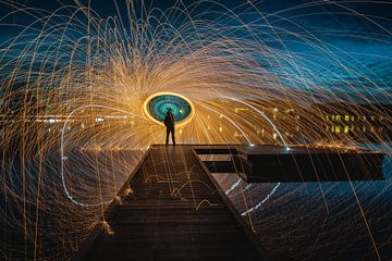 Steel wool swinging on a riser in Ypenburg The Hague by Jolanda Aalbers