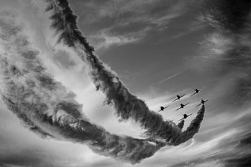 Airshow with flying squadron and smoke in cloudy sky in black and white by Dieter Walther