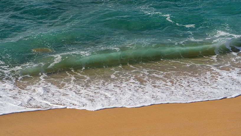 Waves on a sandy beach with clear water by Jonas Weinitschke