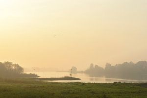 Sunrise over the river IJssel during a beautiful fall morning