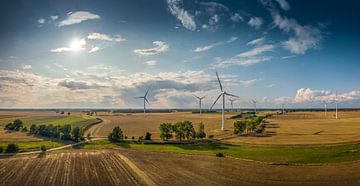Panorama of a beautiful landscape with wind turbines in good weather by Jonas Weinitschke