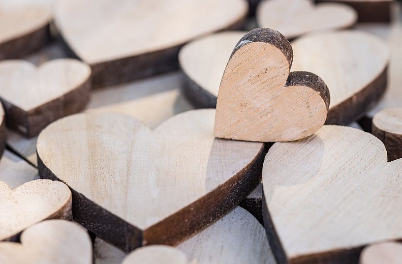 Valentine day background with many wooden love hearts by Alex Winter