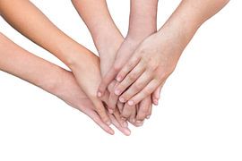 Multiple arms of girls with hands on each other isolated on white background by Ben Schonewille
