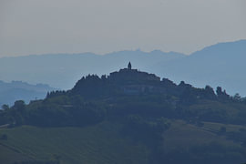 A village on a hill in Le Marche, Italy by Erik Buitenhuis