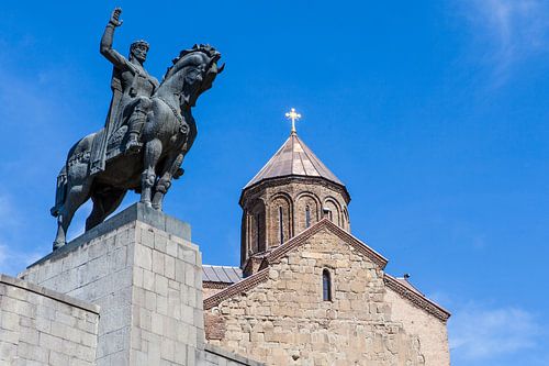 Statue of horseman and Georgian Metekhi Saint Virgin church in the center of Tbilisi, Georgia