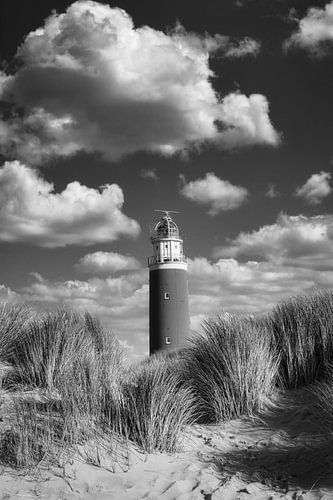 Lighthouse between the clouds in black and white