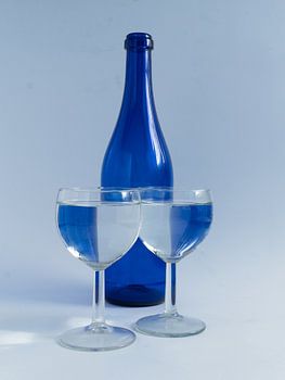 Bottle and glasses in blue