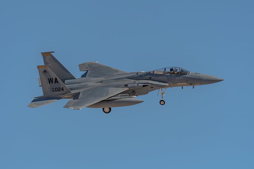 A McDonnell Douglas F-15C Eagle returns to its home base Nellis Air Force Base. by Jaap van den Berg