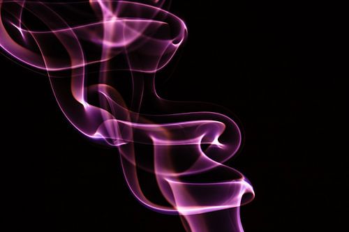 Purple incense on a black background