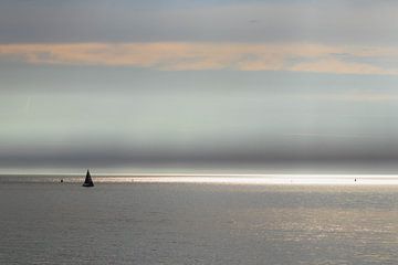 Sunbeams and sailing yacht at sea by Anne Zwagers