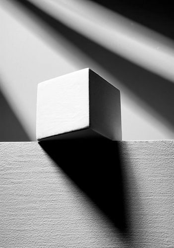 white cube with two diagonal stripes of light