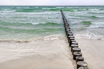 Groyne in the Baltic Sea with green waves