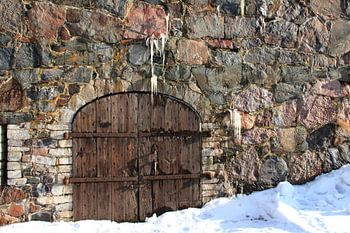 Old door with rocks
