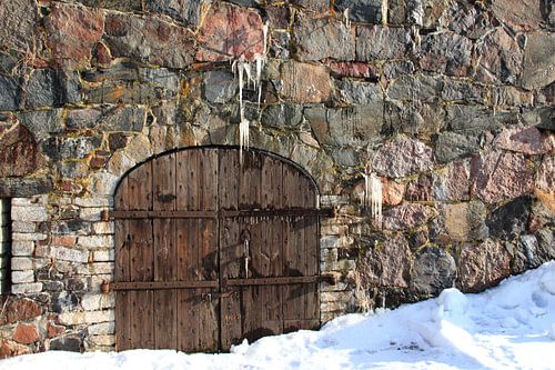 Old door with rocks