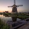 Windmill with setting sun by Remco van Adrichem