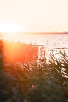 Coloured sunset at Lake Balaton on the south side of the lake with fishing platform