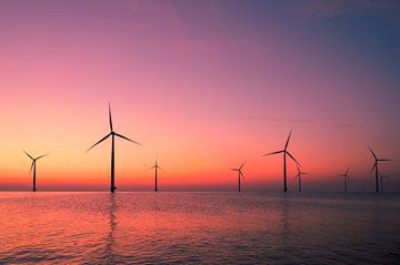 Wind turbines in an offshore wind park producing electricity by Sjoerd van der Wal