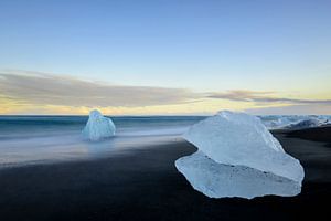 Iceberg block shape on the Jokulsarlong lava beach during sunset
