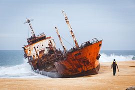 Shipwreck on a beach in West Africa by Bart van Eijden