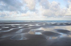 Structures and reflections of the cloudy sky on the beach near Wissant (Opal Coast, France)