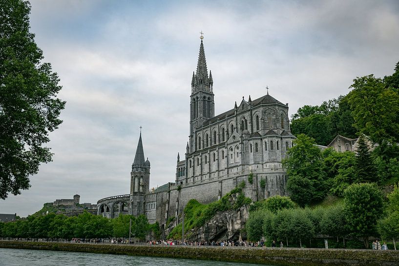 one of the churches in lourdes with pilgrims all over the place by ChrisWillemsen