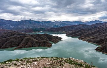 Mountainous landscape over reservoir lake by Werner Lerooy
