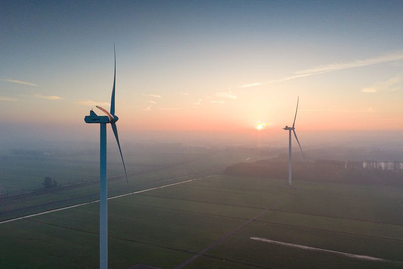 Wind turbines producing sustainable energy during sunrise by Sjoerd van der Wal Photography