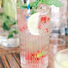 Glass with lemonade and fresh red fruit by Diana van Neck Photography