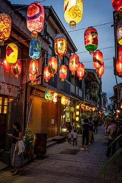 Street with lanterns at night in Taiwan by Mickéle Godderis