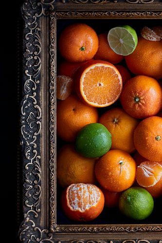 Still life of juicy citrus fruit in an antique painting frame by Fenja Jon-Blaauw - Studio Foek