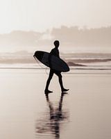 Surfer at sunset on Echo Beach - Canggu, Bali