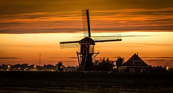 Dutch windmill at sunset 