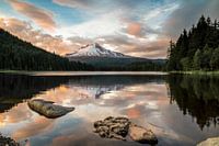 Snow capped volcano at a mountain lake