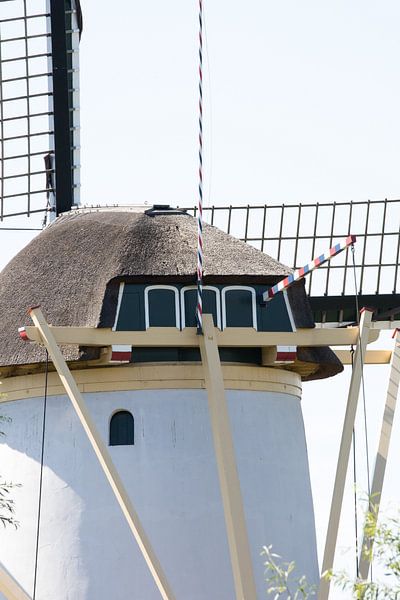 Closeup of Dutch windmill in Schiedam The Netherlands during summer. by N. Rotteveel