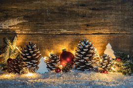 Christmas traditional decoration with pine cones, festive lights by Alex Winter