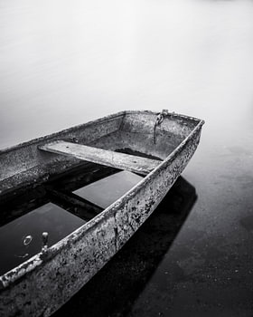 Abandoned boat in black and white
