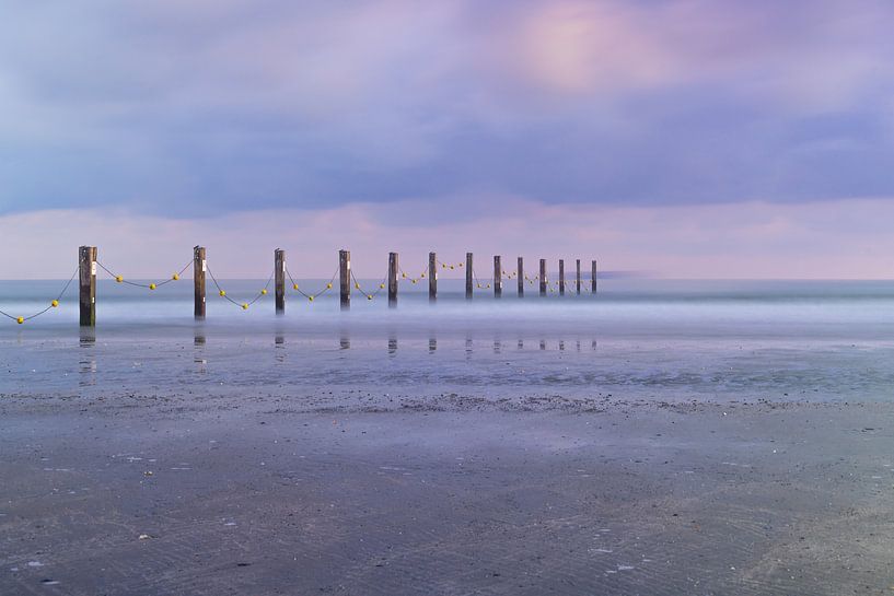 Posts on the beach on the Belgian coast by E Picqtures