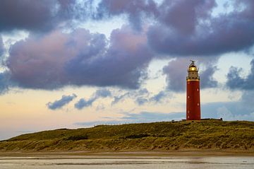 Texel lighthouse in the dunes during a stormy autumn evening