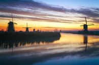 Kinderdijk zonsopkomst met mist van Roy Poots thumbnail