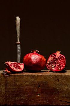 Pomegranate with knife