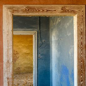 Kolmanskop Red, Blue Yellow and sand by Ton van den Boogaard