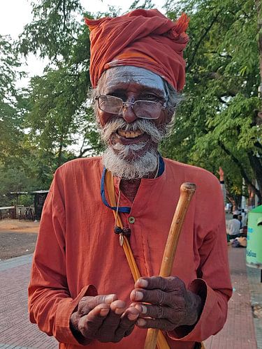 Indian sadhu by the road in Tiruvannamalai Tamil Nadu by Eye on You